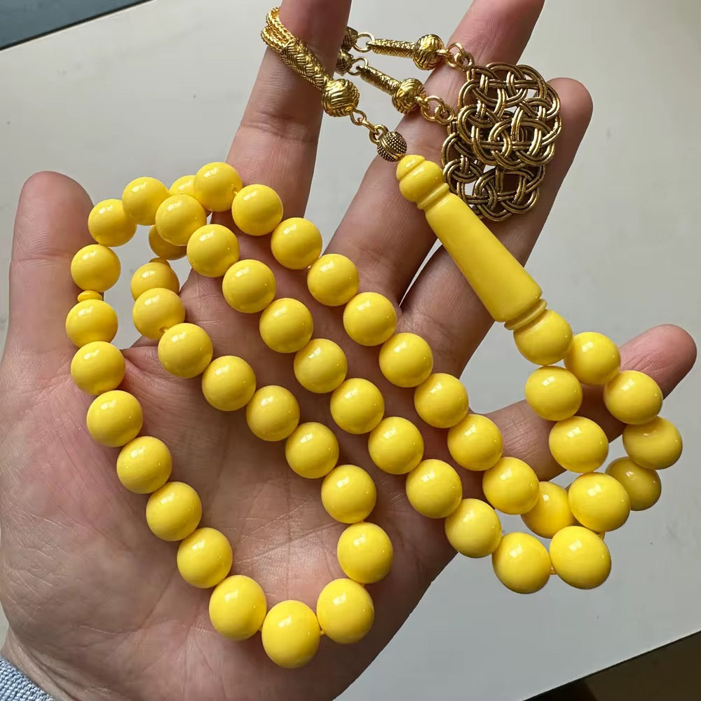 مسباح اصفر كركوشة ذهبية